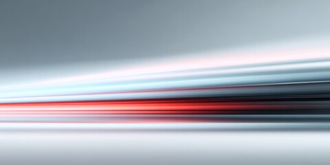 Sleek horizontal light streaks in cool gray tones with a central red accent convey motion and speed.