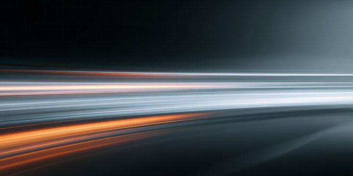 Streaks of bright white and warm orange light blur across a dark, abstract background indicating rapid motion.
