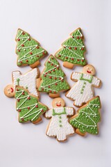 Isolated on a white background are Christmas cookies in the shape of a Christmas tree, made in a knitted style