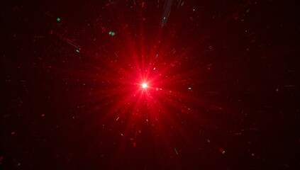Shining central red light source sending radial beams in dark maroon void, with teal-green flecks