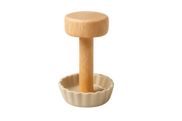 Wooden pie tamper forming dough in ceramic tartlet mold