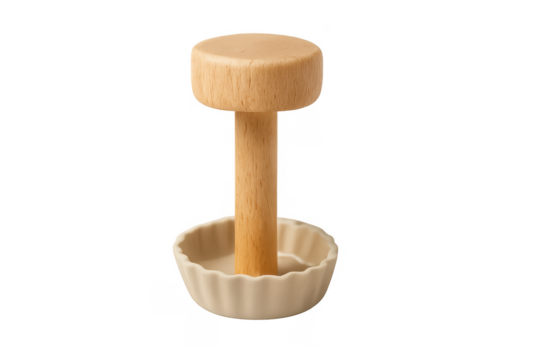 Wooden pie tamper forming dough in ceramic tartlet mold