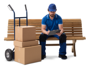 A delivery courier sitting on a bench with a hand cart of parcels, checking deliveries on a clipboard, isolated on a white background.