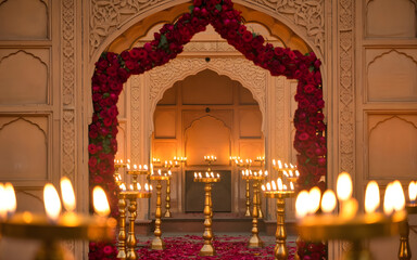 Cinematic Mughal Courtyard Archway Backdrop with Red Roses, Candlelit Stone Carvings and Golden Romantic Ambience