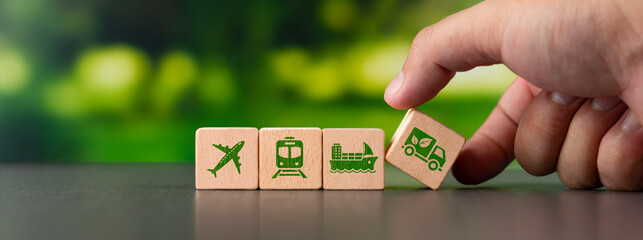 Wooden blocks with green icons, driving business while caring for nature. Every transport has an environmental impact, and we're ready to join forces with green transport.