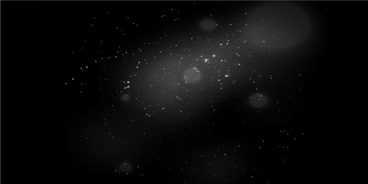 Abstract black and white space background with bright star particles in a dark night sky universe resembling a nebula or galaxy