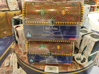 Fototapeta premium Rome, Italy - November 20, 2025: Harry Potter Advent Calendar Quidditch themed gift box displayed on a retail table, showcasing vibrant colors and intricate designs for fans of the series