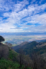 Obraz premium Hiking on trail along abandoned open-pit mine and burnt trees near Mijas, Spain 