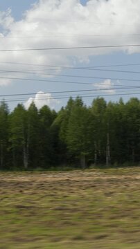 sunny summer day farmers field forest background landscape passenger side window pov vertical panorama 4k