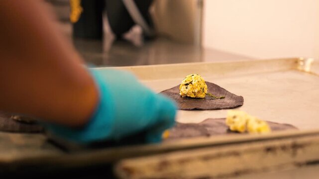blue corn enchiladas being made