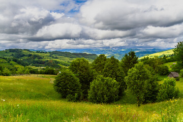 Beautiful rural landscape with hills, forests and fields. Maramures, Romania