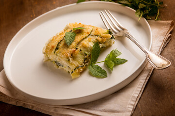 Zucchini flan with cheese and mint leaves