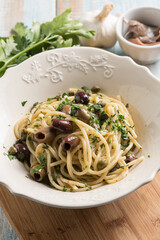 spaghetti with anchovy capers  black olives and parsley