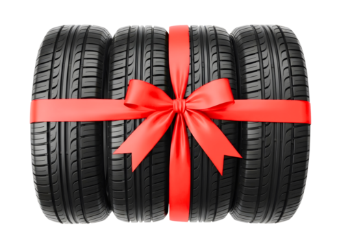 Three car tires tied with a red ribbon isolated on transparent background