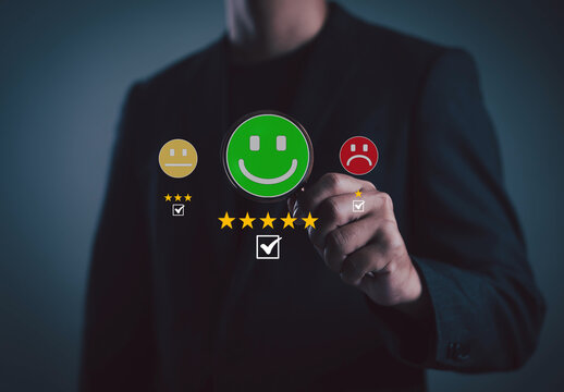 business professional selecting a positive satisfaction rating on a digital interface, featuring green smiley icons, star reviews, and feedback options representing customer experience service quality