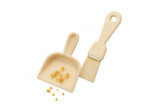 Miniature dustpan and brush collecting crumbs