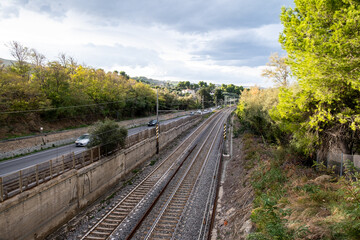 Parallel railway tracks and Strada Statale Adriatica in Pineto, Abruzzo, connecting transport and natural landscapes