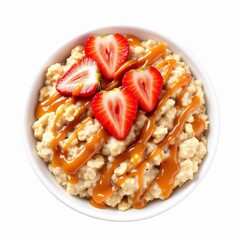 Bowl of warm oatmeal topped with fresh sliced strawberry and drizzled with caramel sauce isolated on white background