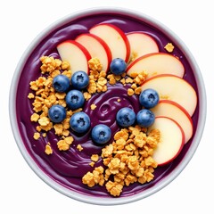 Overhead view of a vibrant aa bowl topped with fresh blueberry, sliced apple, and crunchy granola isolated on white background