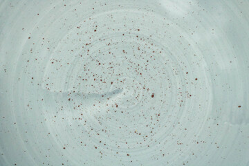 Mottled enamel texture on a clay plate