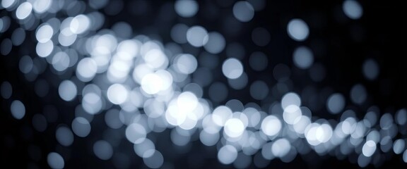 Abstract snow bokeh, white luminous dots on deep black, background, bright