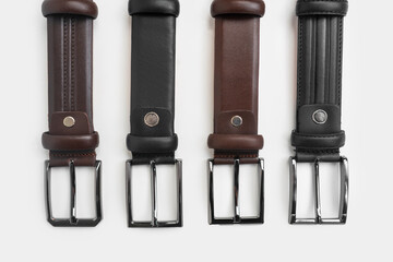 Leather Belts in Row on White Background