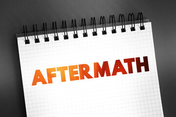 Aftermath text on notepad, concept background