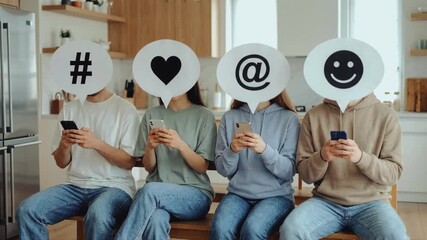 People holding social media icon speech bubbles over faces while using smartphones. Group sitting with hashtag, heart, mention, and smiley signs. Digital communication and technology addiction concept