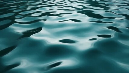 Captivating deep teal water surface with gentle ripples and shimmering reflections, an abstract liquid texture evoking tranquility and serene movement, ideal for peaceful backgrounds - Powered by Adobe