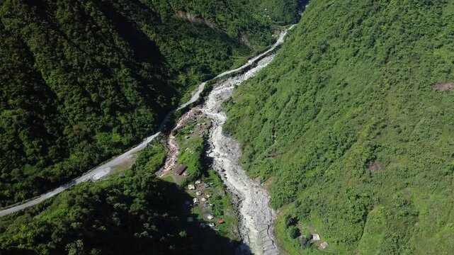 Aerial view of the Kali Kabur River between two hills, traditional gold mining activities from PT Freeport Indonesia's tailings have become a source of income for some residents of Mimika Regency.