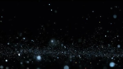A dynamic field of glowing blue and white particles against a black background suggesting stardust or bokeh effects. - Powered by Adobe