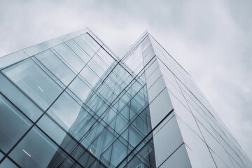 Modern corporate structure exhibits sharp angular geometry against an overcast sky