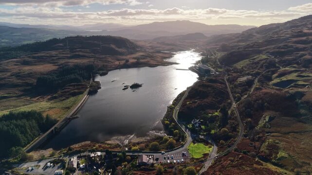 The epic Llyn Ystradau and Ffestiniog Power Station - drone flyover on a sunny winter's afternoon, North Wales, UK