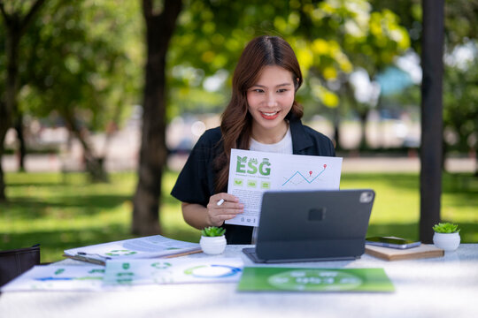 Young businesswoman presenting esg report during outdoor video call