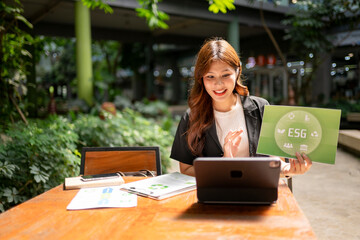 Businesswoman presenting esg concept during video conference outdoors