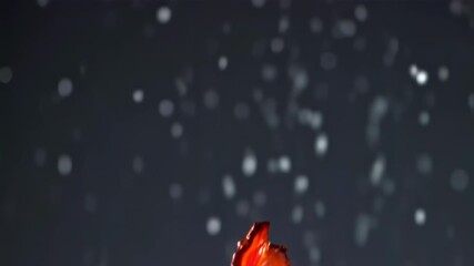 Crispy bacon slice with glistening particles falling, ideal for food promotion