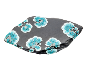 Stunning teal lichen growing on a dark textured stone, a captivating display of nature's artistry, ideal for scientific studies and unique design concepts