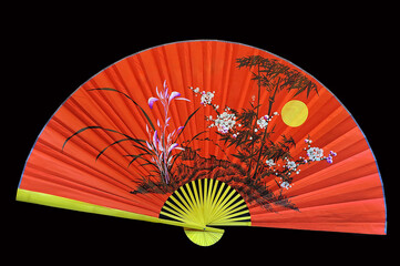Japanese folding red hand fan on black background