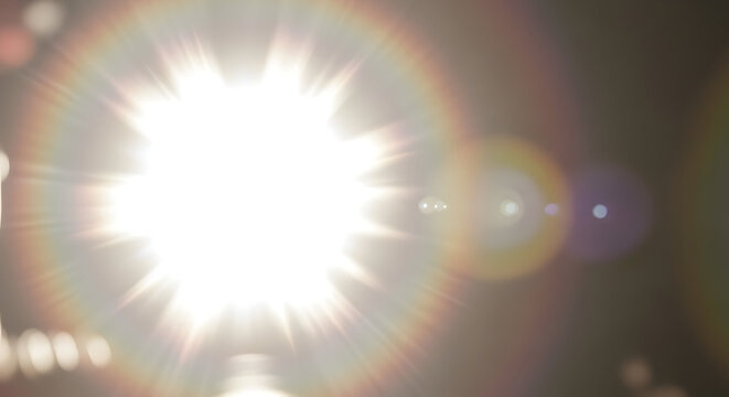 Bright starburst lens flare silhouette