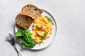 Scrambled eggs with greens for breakfast
