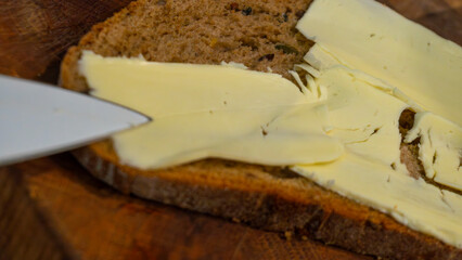 bread and butter. Close-up of a sandwich with butter.