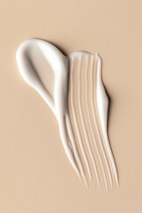 White Cream Smear on Beige Background