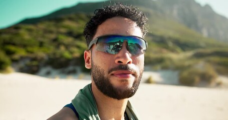 Runner, sunglasses and face of man at beach for fitness gear, glare protection and health. Sports athlete, flare lens and cardio training with person outdoor for wellness, workout and exercise - Powered by Adobe