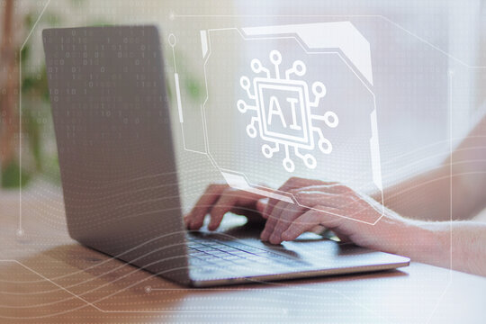 Hands typing on laptop keyboard with digital AI chip icon overlay and circuit graphics. AI machine learning chatbot concept