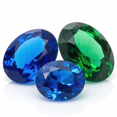 Three oval-cut gemstones, vibrant blue, blue-green, and green, arranged on a white background