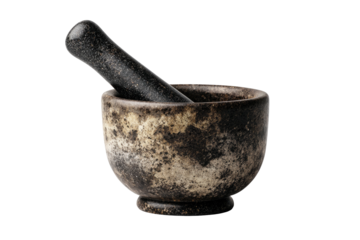 Close-up of a stone mortar and pestle on a black background
