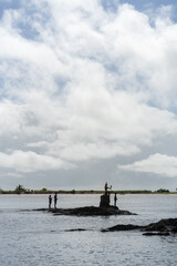 Fishermen on the Rocks and Boat in Itacaré Bahia Brazil
