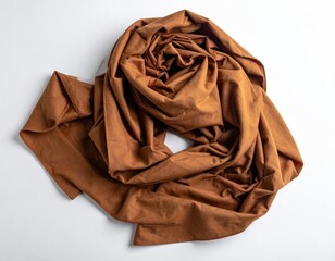 A warm, earthy-toned shawl, draped in a loose, swirling pattern, lies on a plain white background