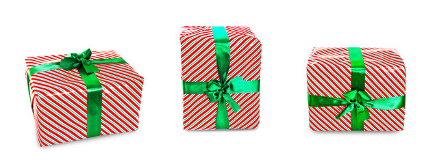 Fototapeta premium Three Christmas presents wrapped in red, white, and green striped paper with green ribbons, isolated on transparent background.