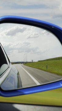 sunny day time green harvest field landscape road trip passenger side window pov vertical panorama 4k